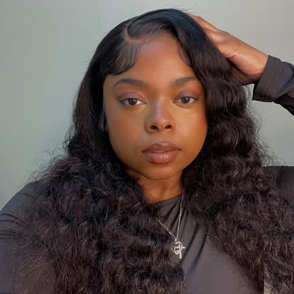 Client with a long, full wavy hair install