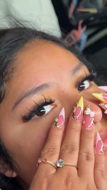 Pink heart-French stiletto nails with lash detail